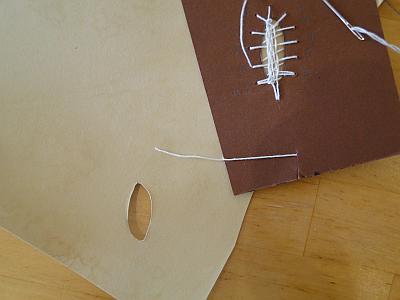 stitching around hole in parchment